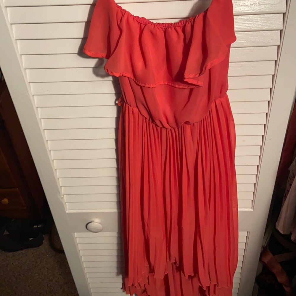 Peach strapless dress. Short in the front and long in the back.
